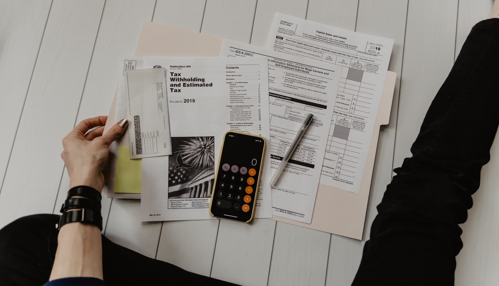 Tax and bookkeeping paperwork on a desk