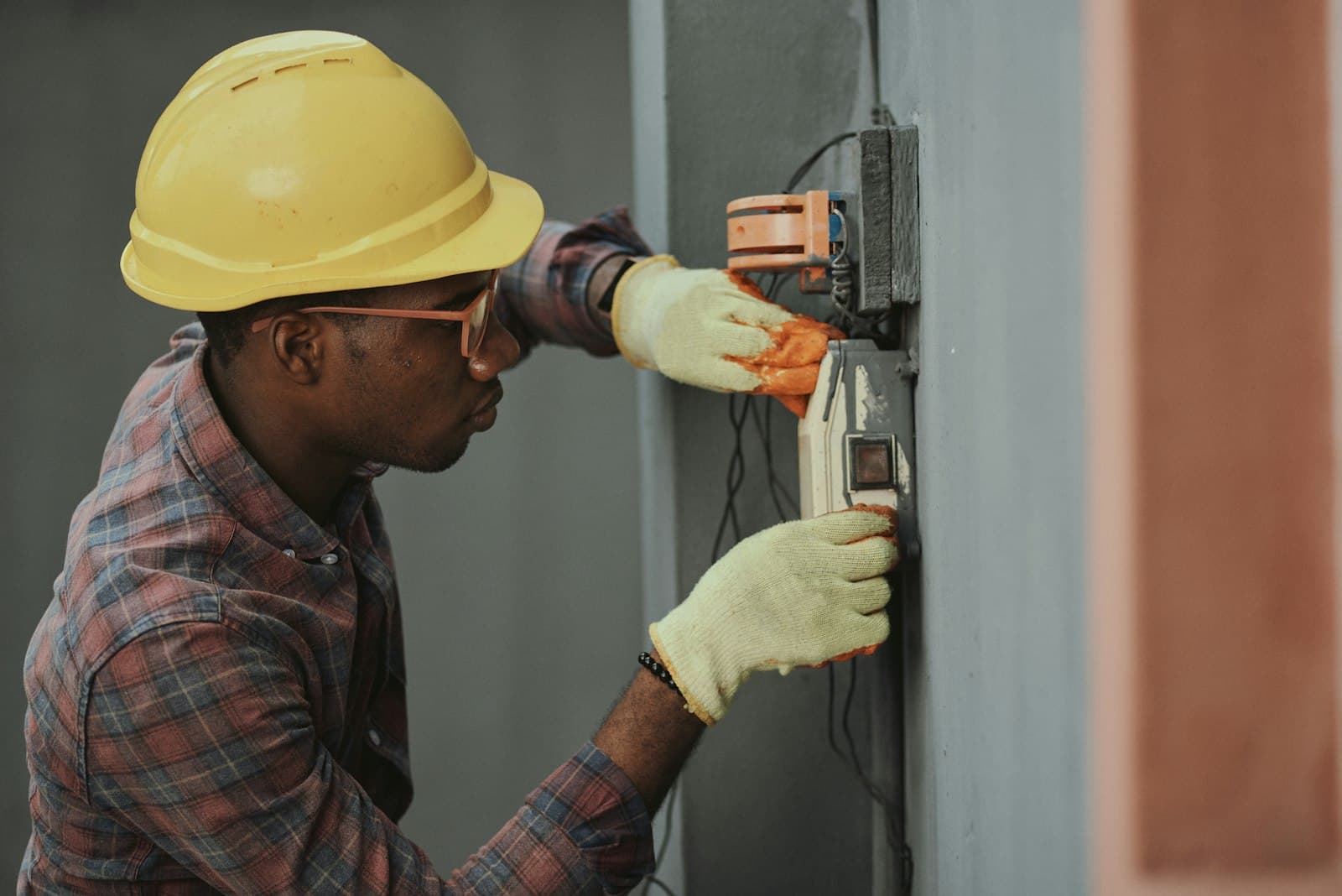 Field service technician working on an electrical panel